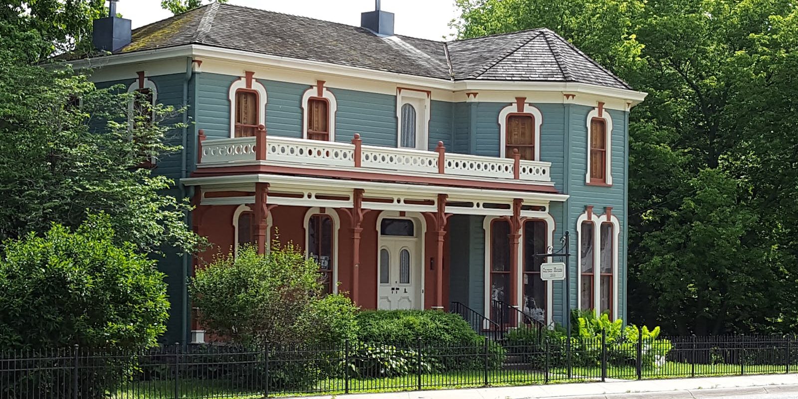 Photo by Austin Landscape Photography of Gray and Brown 2 Storey House