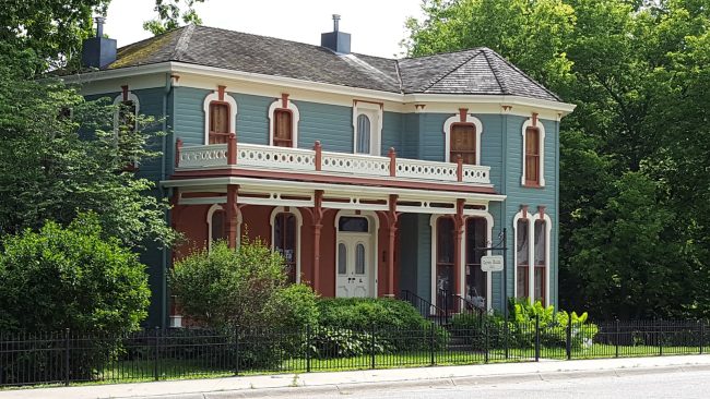 Photo by Austin Landscape Photography of Gray and Brown 2 Storey House