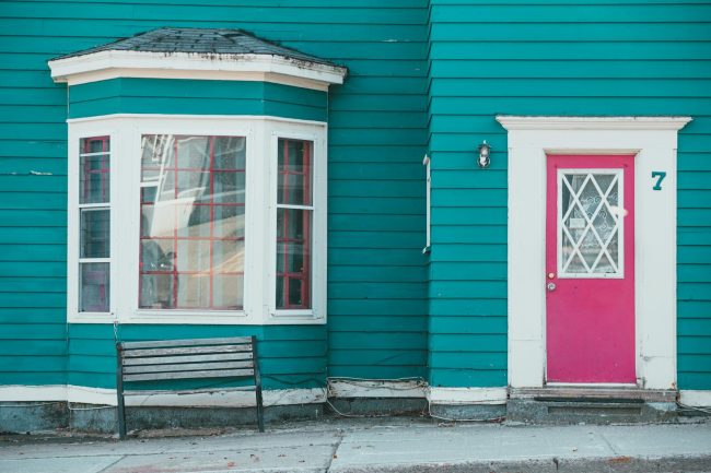 Photo by Erik Mclean A Blue House with a Red Door
