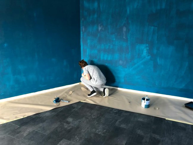 Photo by Rene Terp Woman In Gray Shirt And Gray Pants Painting The Walls